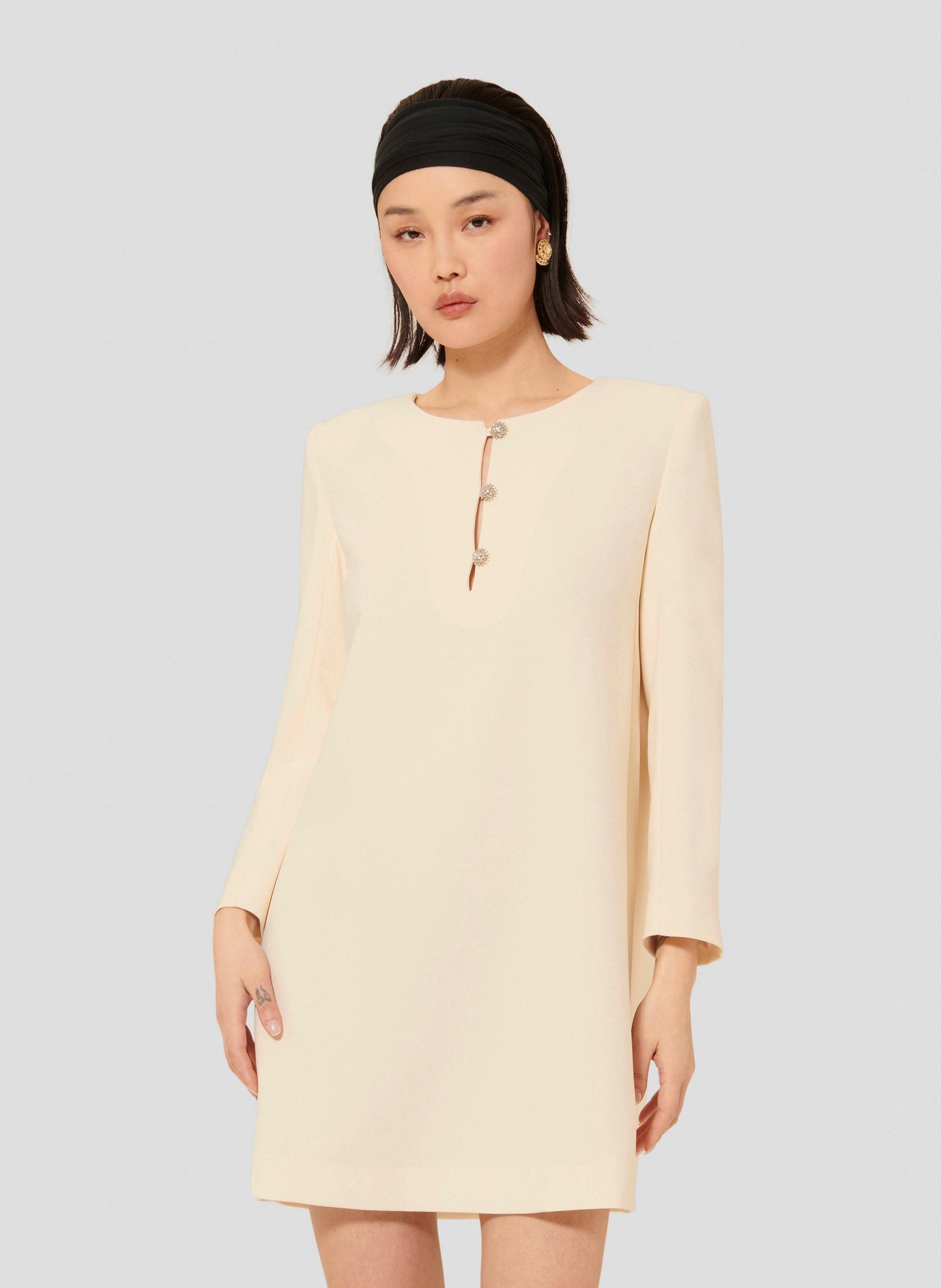 Straight cut short ecru dress with epaulets.