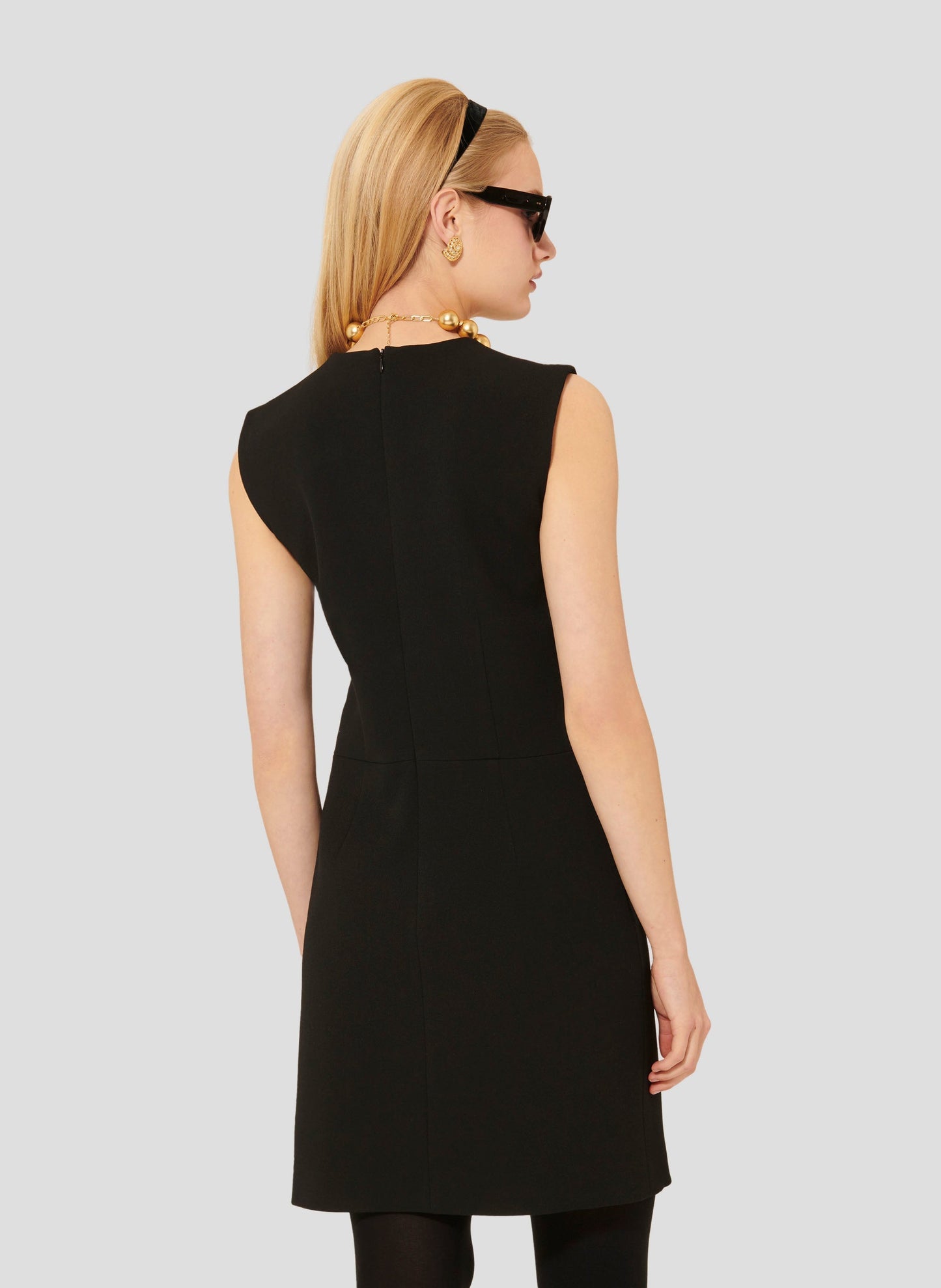 Black short fitted dress with invisible zip.
