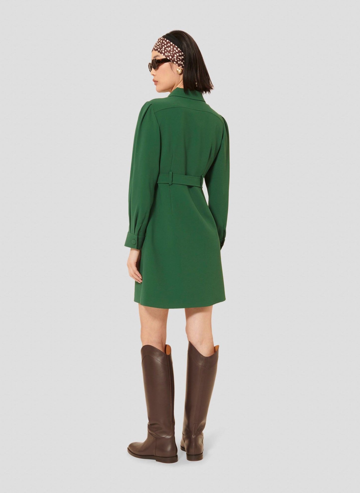 Green short dress with adjustable belt.