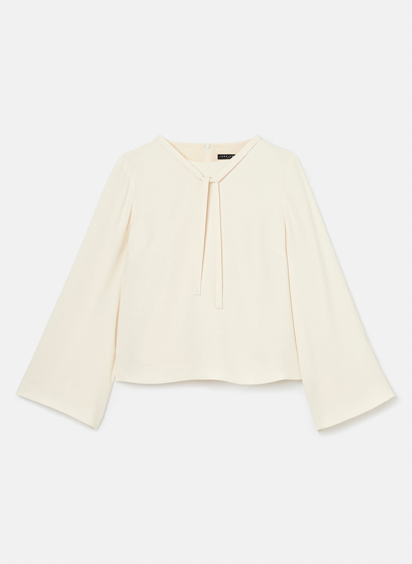 Ecru crepe top with straight cut, round neckline, and long, wide sleeves.