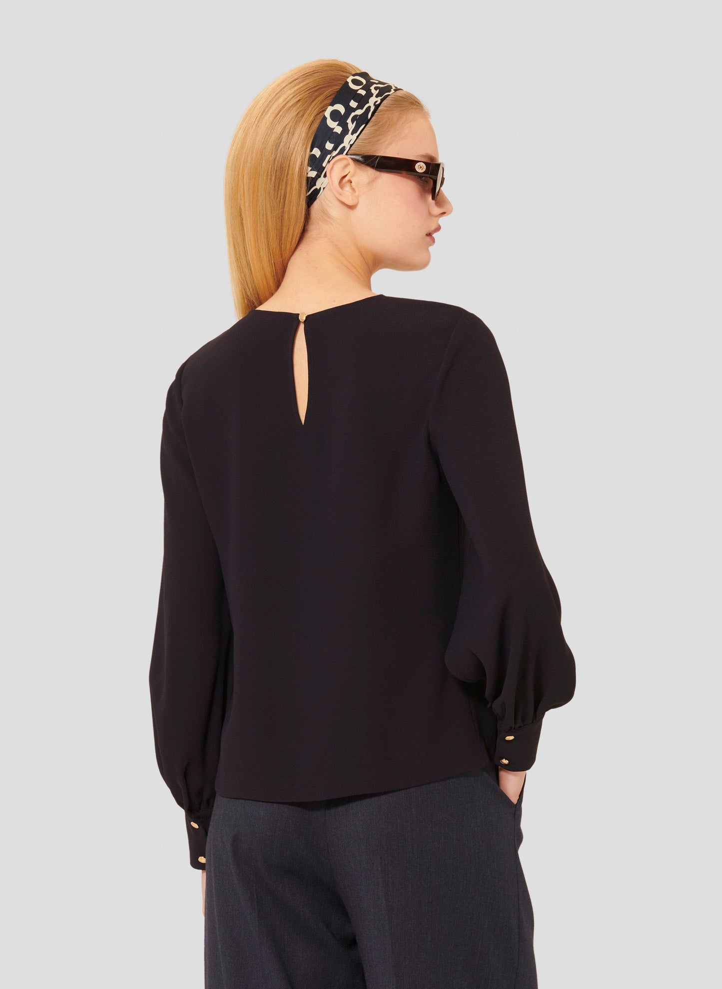 Versatile Midnight Blue Top with Long Sleeves and Buttoned Cuffs.