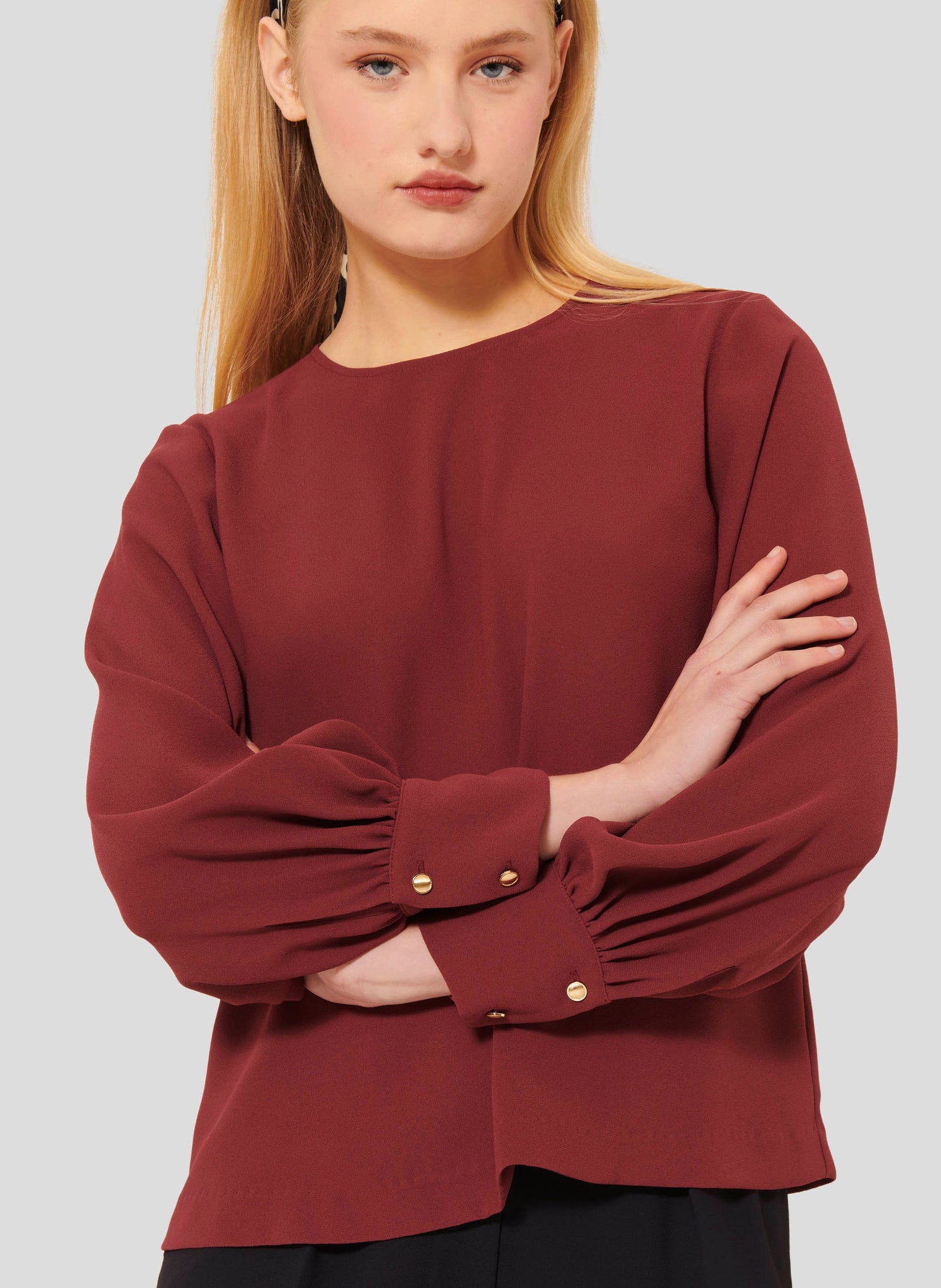 Round Neck Top in Burgundy with Gold Button Closure.