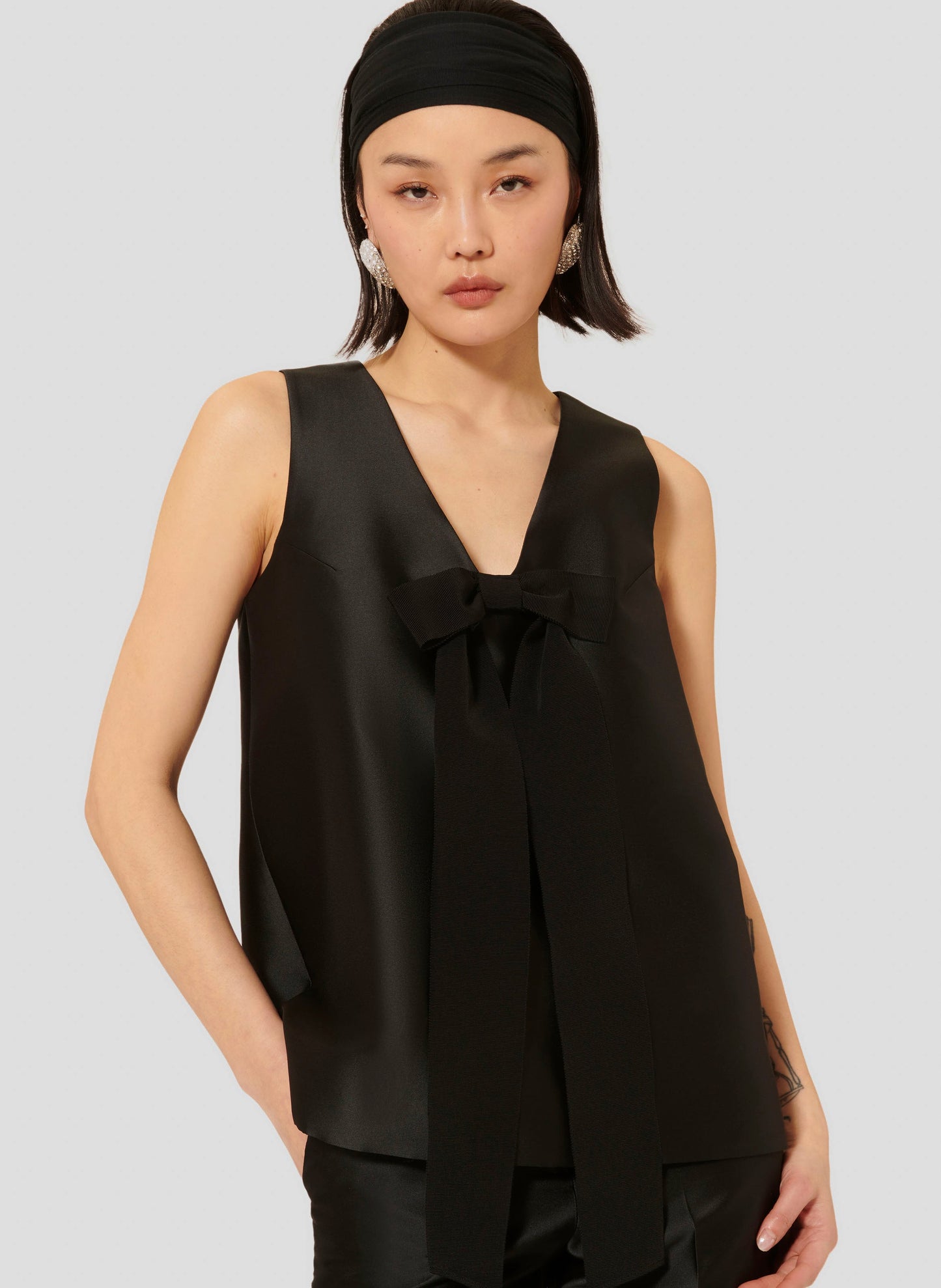 Sleeveless Top in Black with Satin Fabric and Hidden Zip.