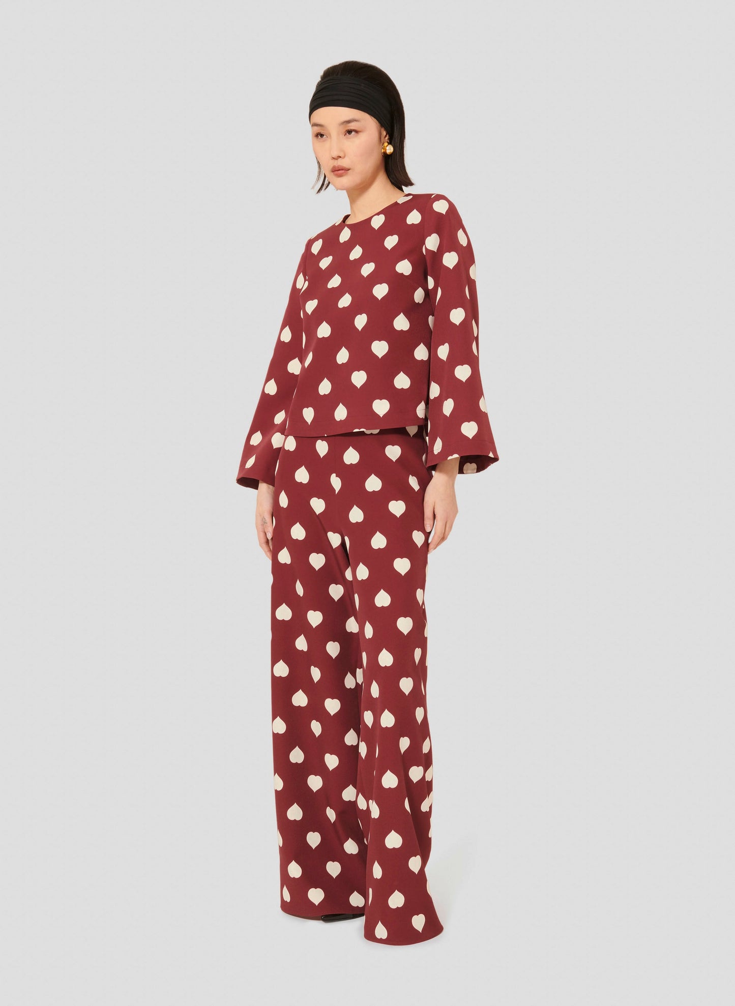 Burgundy Top with Heart Print and Flared Sleeves.