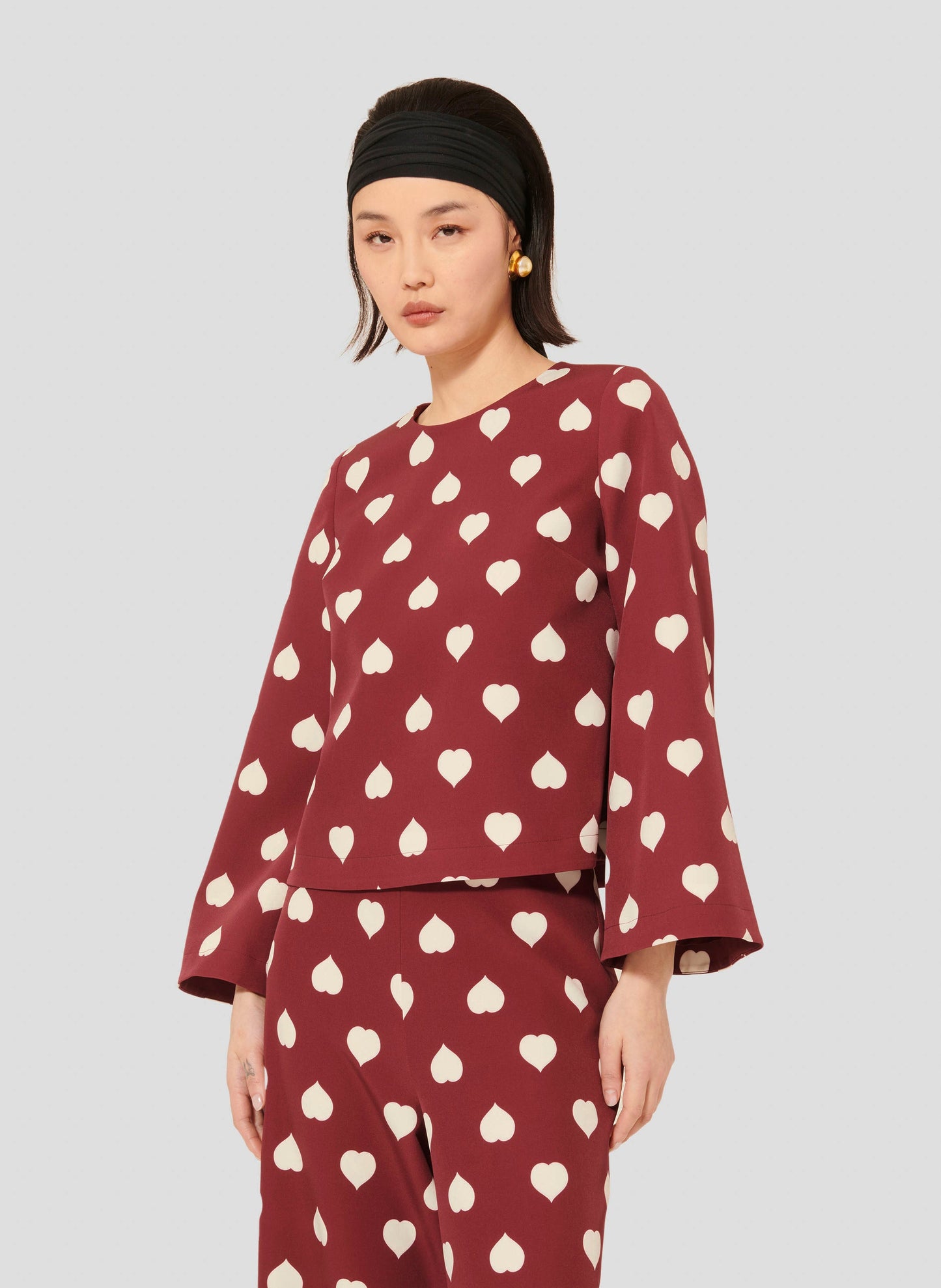Stylish Burgundy Top with Heart Print and Relaxed Fit.