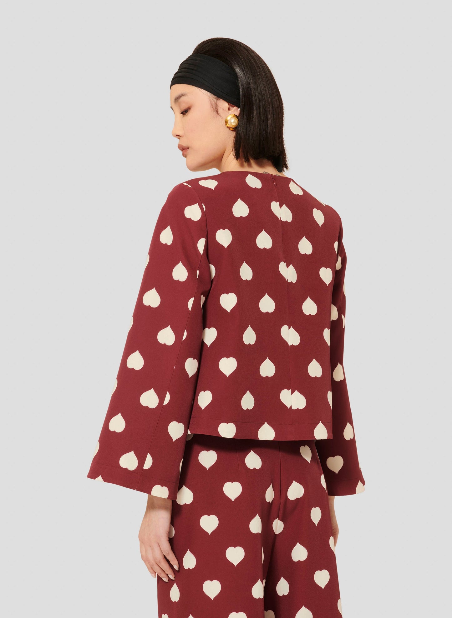Versatile Burgundy Top with Flared Sleeves and Hidden Zip on the Back.