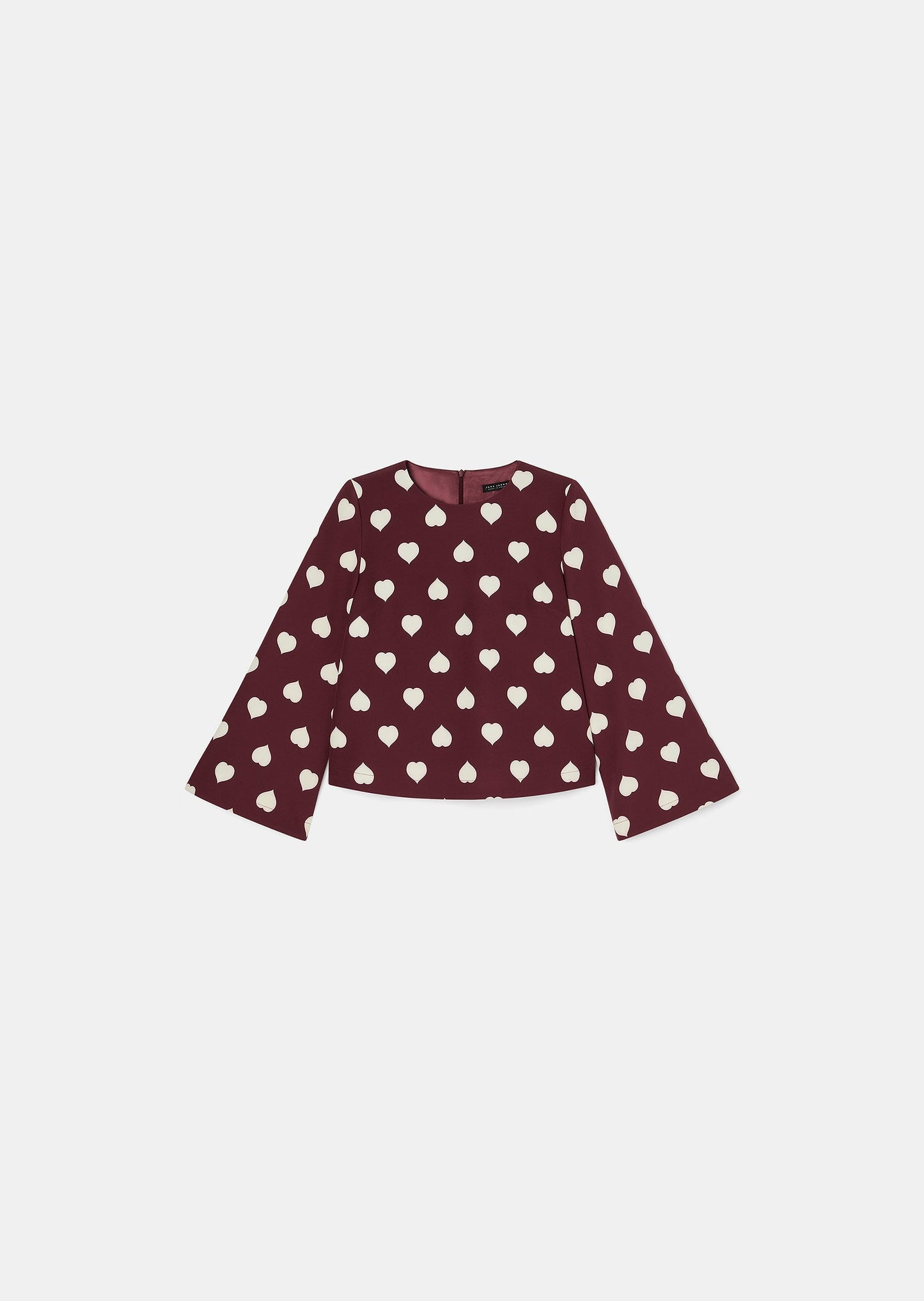 Comfortable Burgundy Top with Round Neckline and Wide Sleeves.
