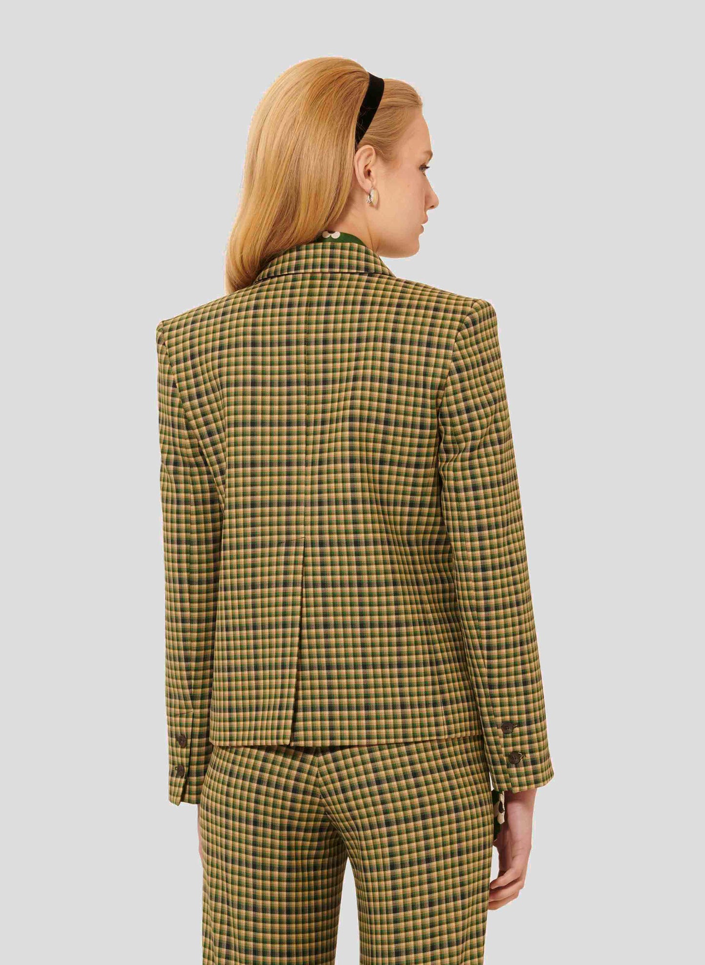 Stylish Green Tartan Jacket with Triple-Breasted Front and Buttoned Cuffs.