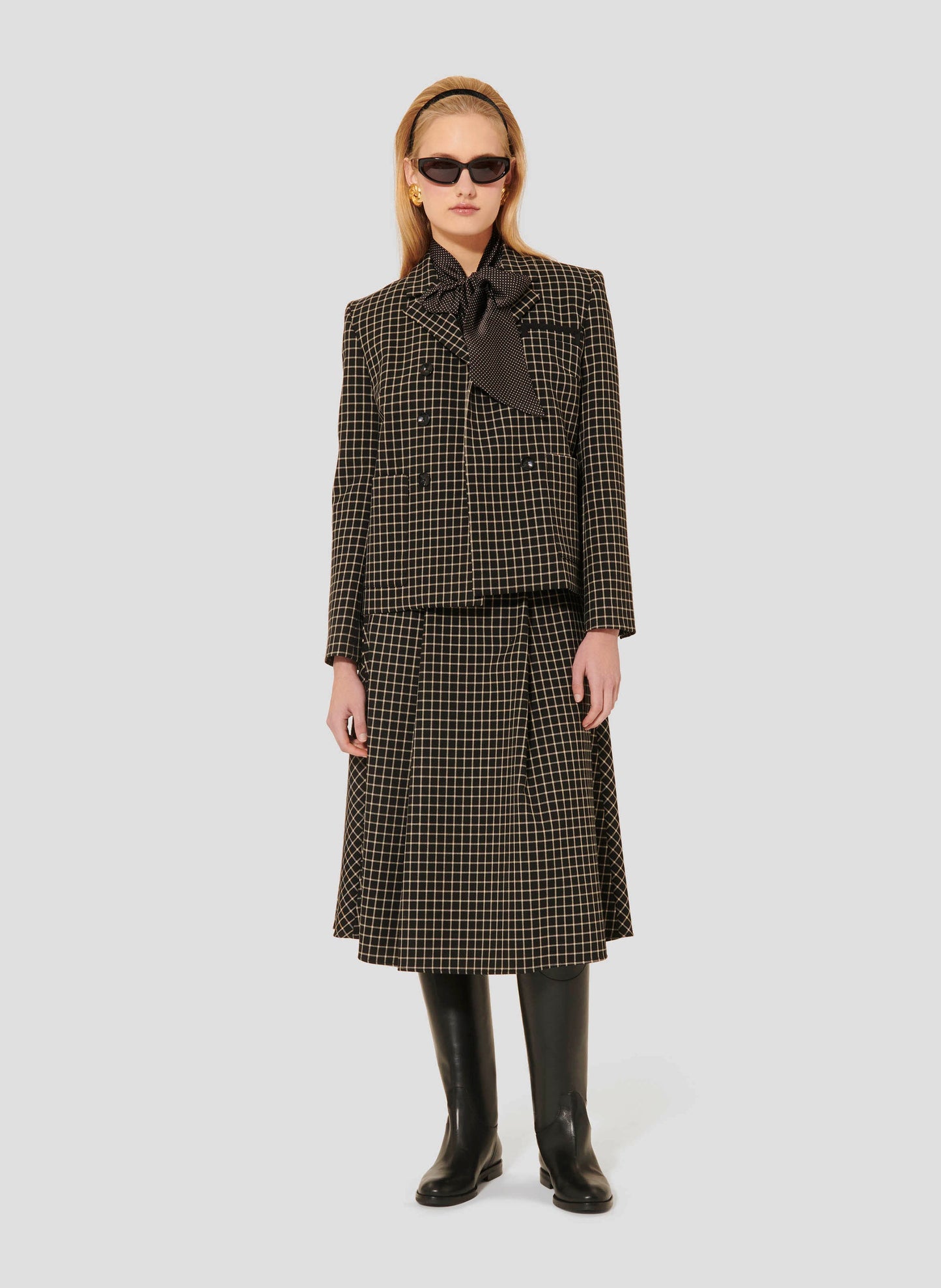 Straight Cut Black Plaid Blazer with two side pockets.