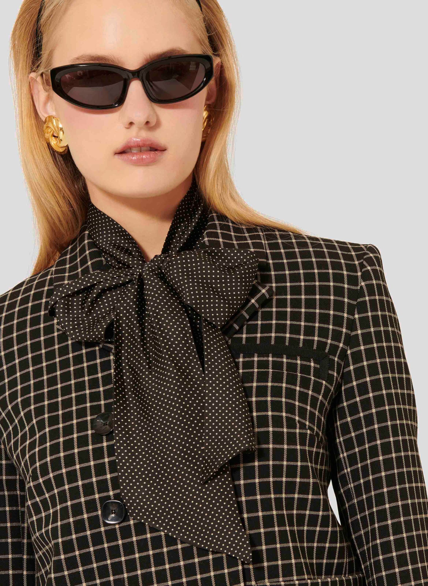 Elegant Black Plaid Suit Jacket with Buttoned Cuffs.
