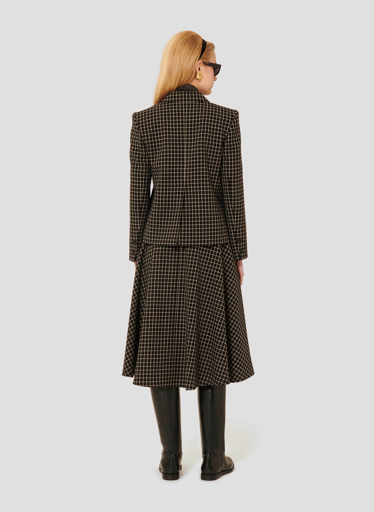Women's Suit Jacket Featuring a Classic Plaid Pattern.