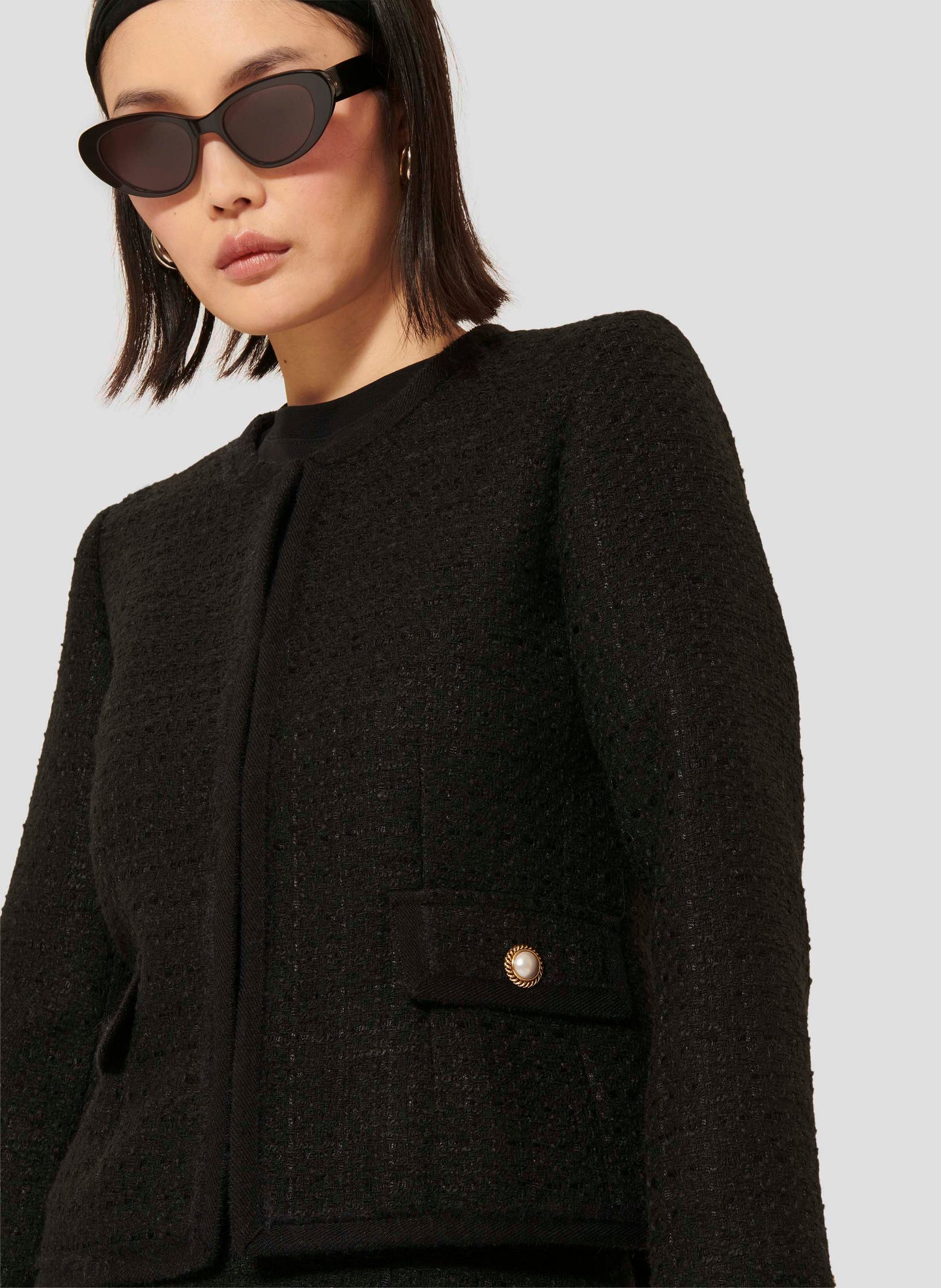 Black Blazer with Long Sleeves and Round Neckline.