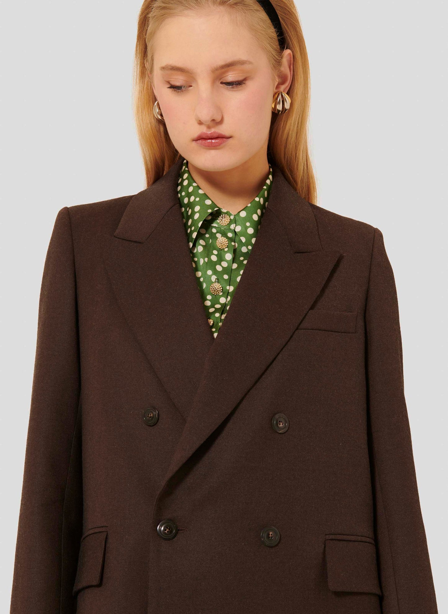 Women's chocolate brown jacket with slightly fitted waist and small shoulder pads.