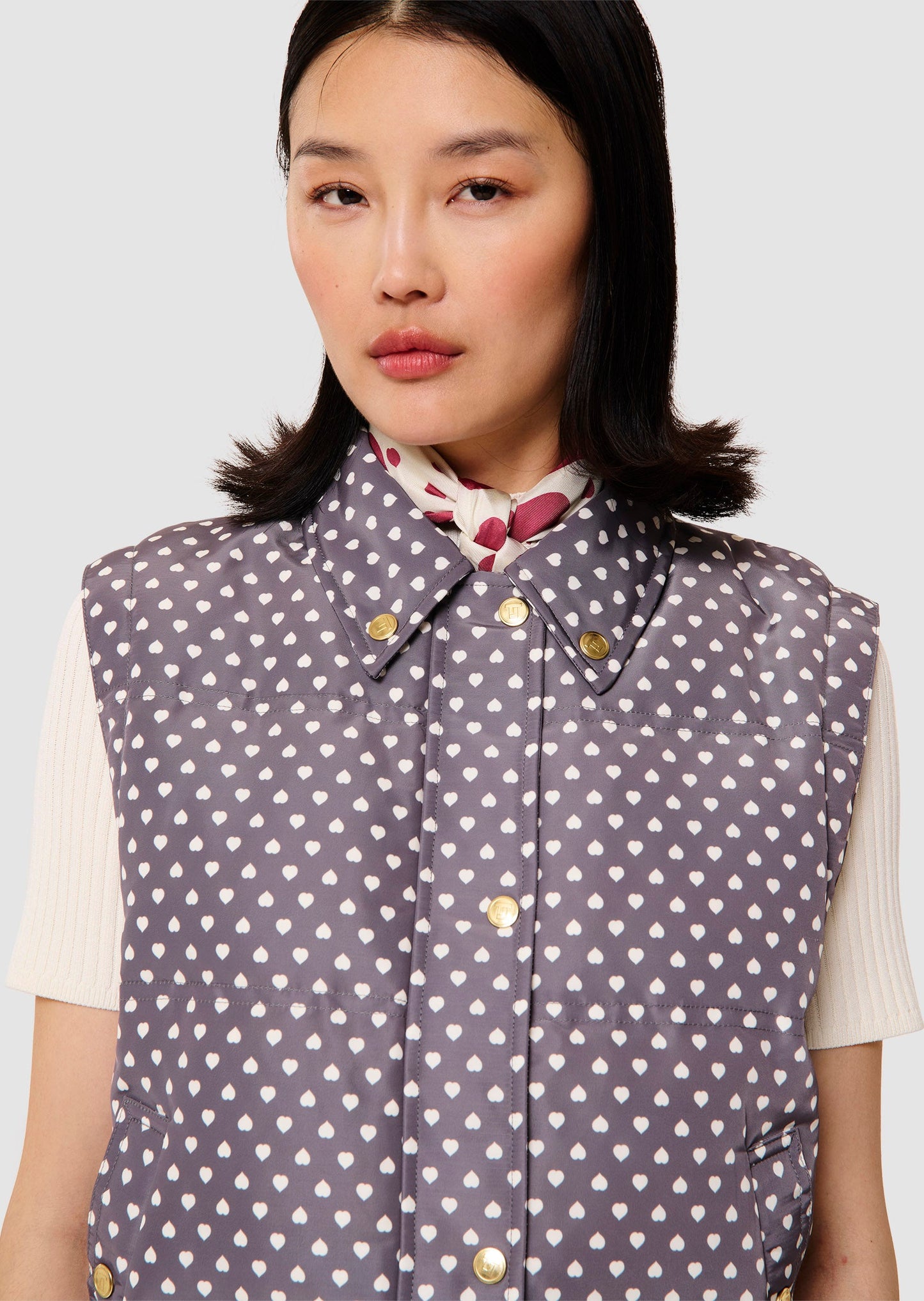 Dora grey sleeveless down jacket with white hearts