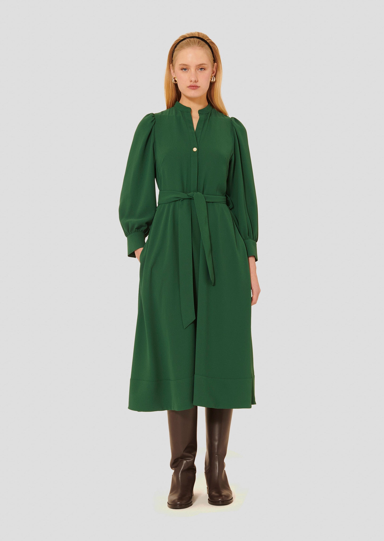 Model wearing Tara Jarmon Long-Sleeve Belted Dress in Emerald Green Crepe with adjustable waist. 