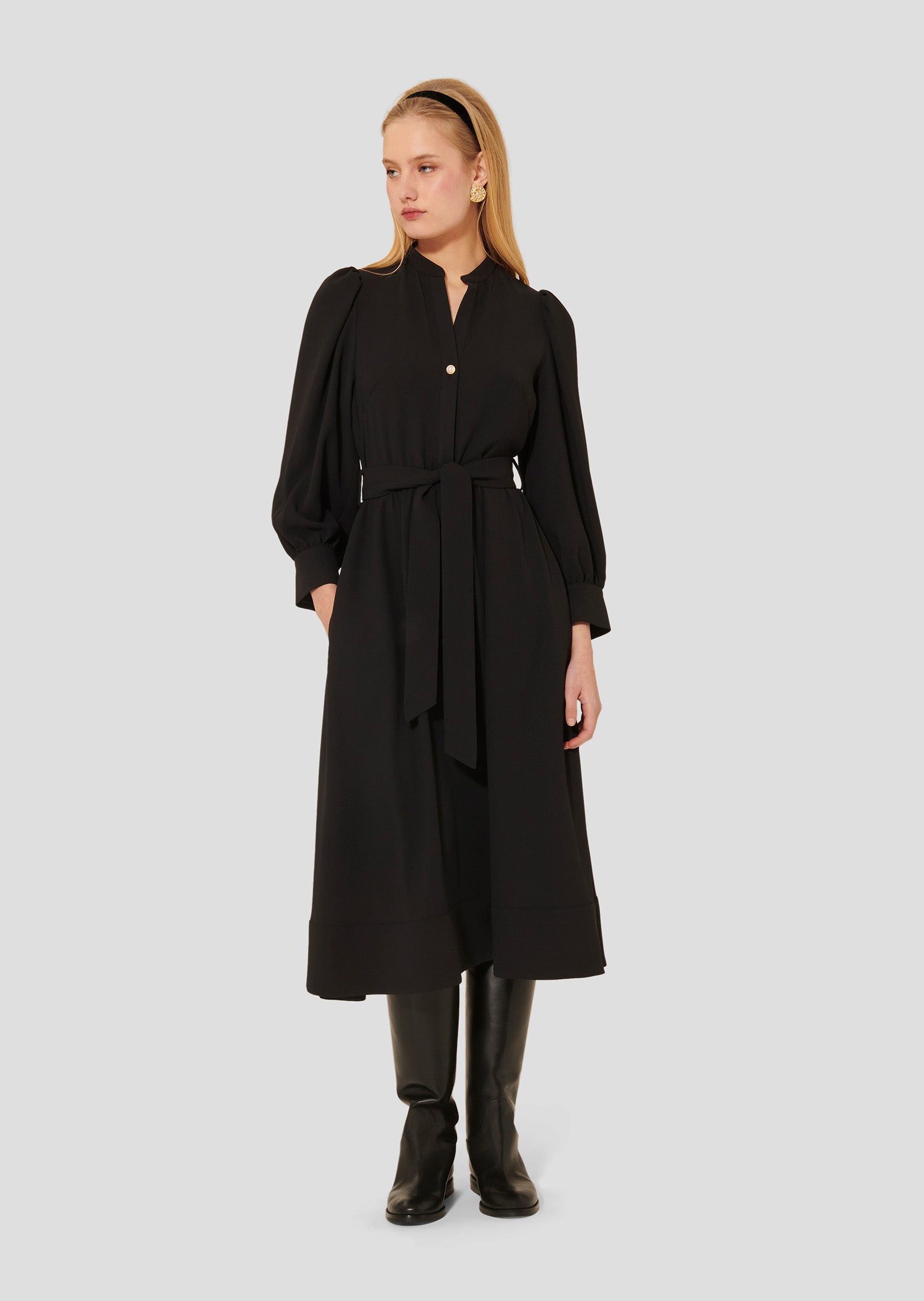 Model wearing Tara Jarmon Long-Sleeve Belted Dress in Black Crepe with adjustable waist. 