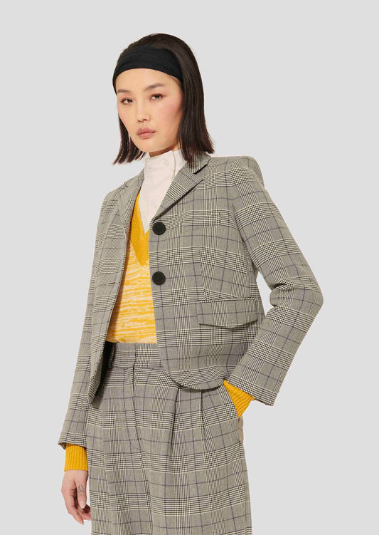 Model wearing Tara Jarmon Grey Glen Plaid Suit Jacket with Lapel Collar and Buttoned Cuffs.