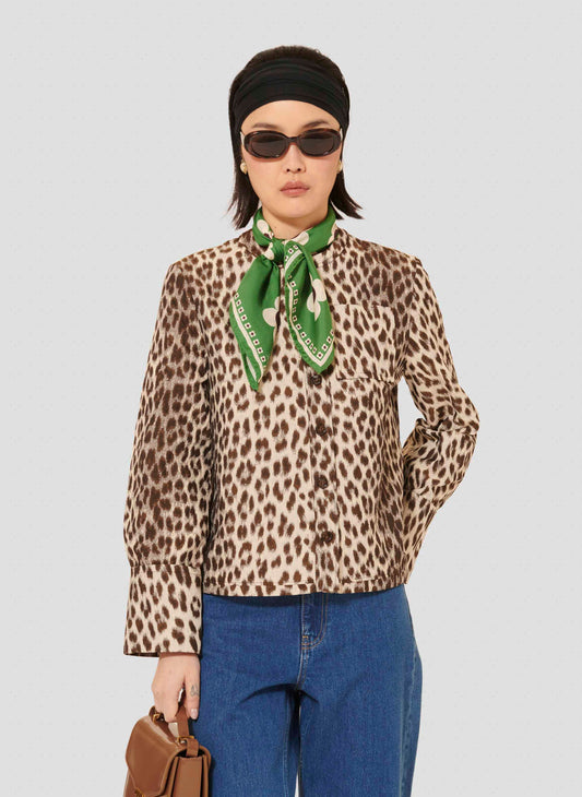 Model wearing Tara Jarmon brown woman leopard printed shirt. 