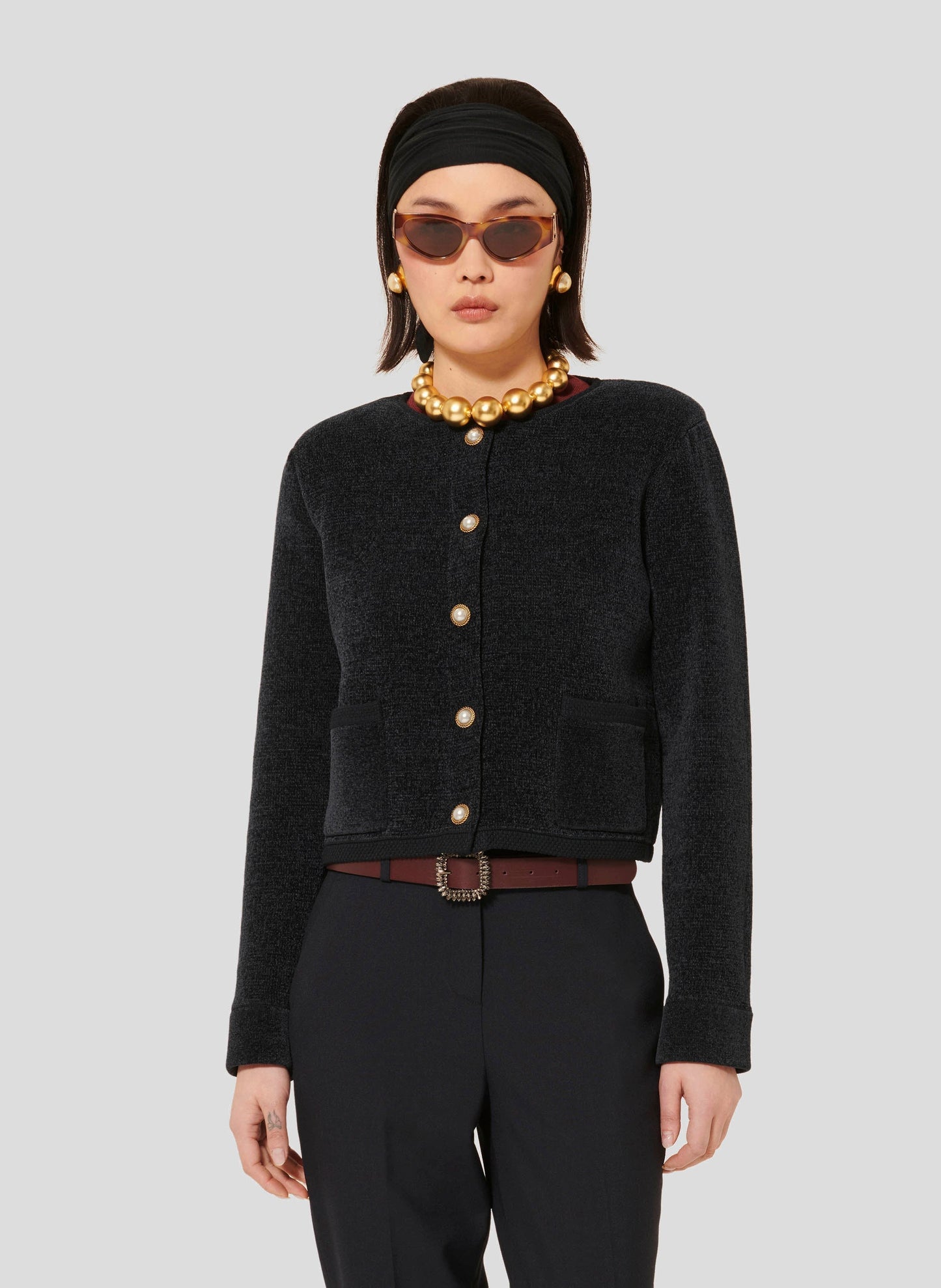 Tara Jarmon model wearing midnight blue compact knit cardigan.
