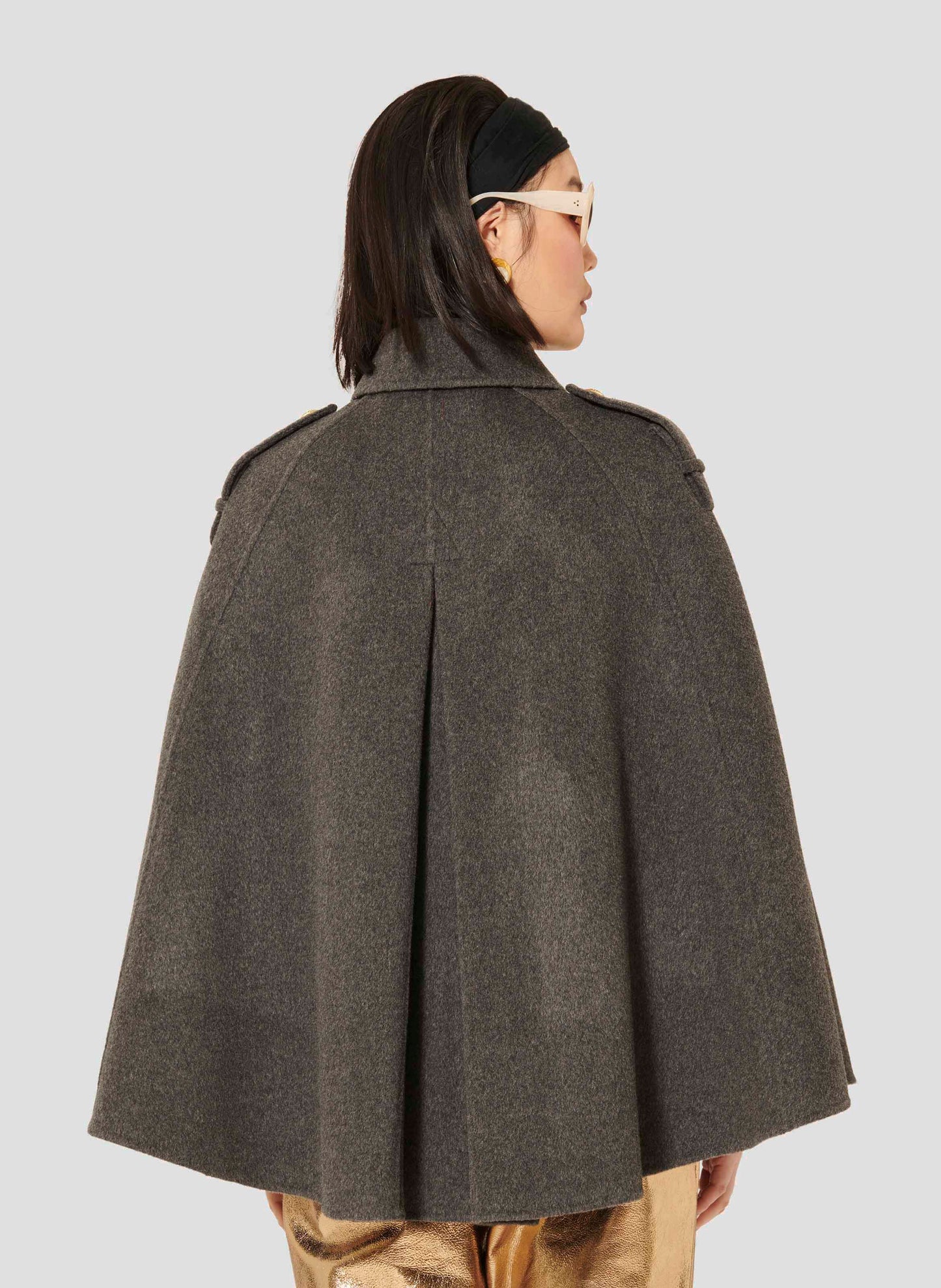 Tara Jarmon model wearing grey cape coat.