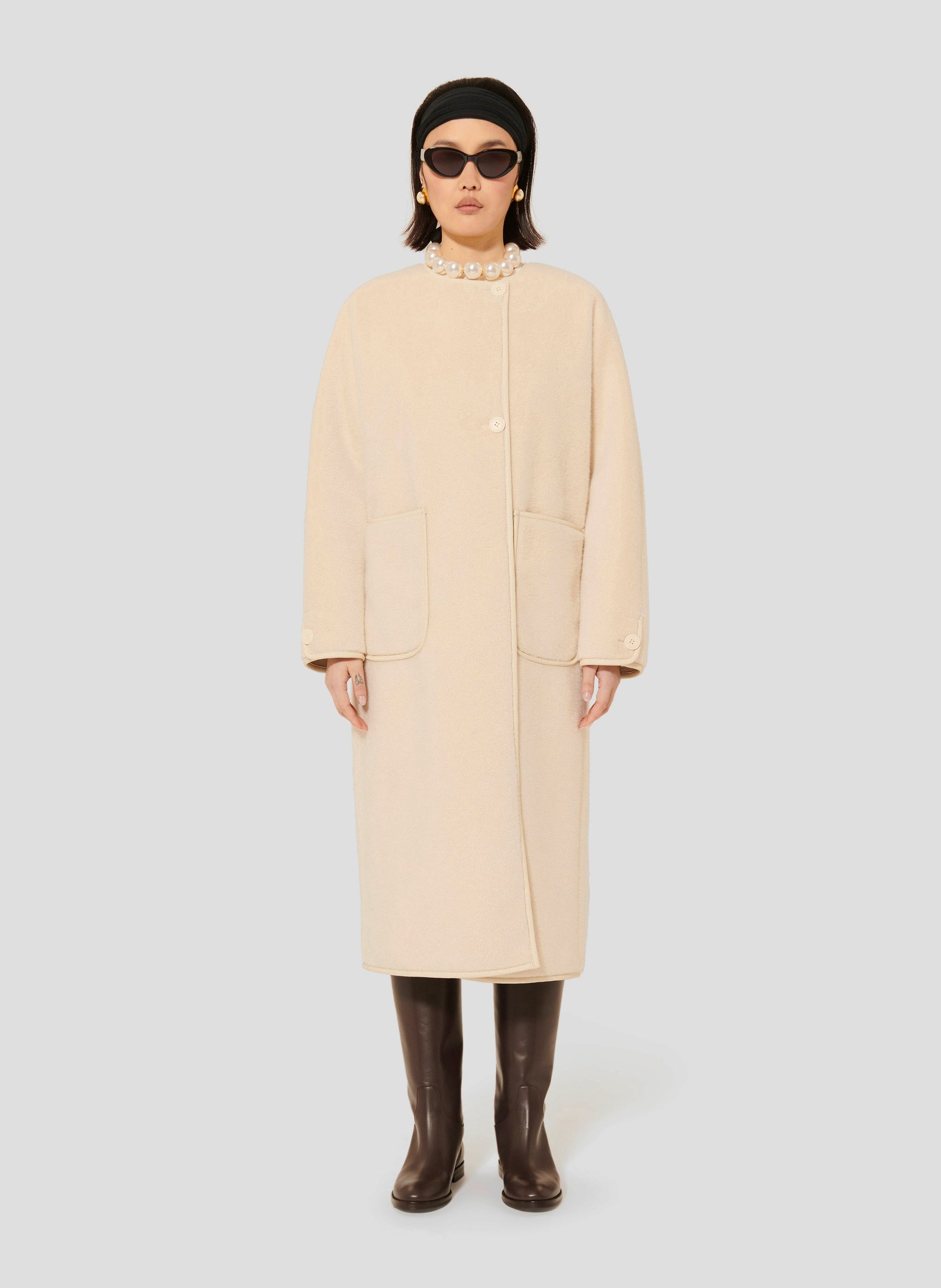 Tara Jarmon ecru faux fur coat with round collar.