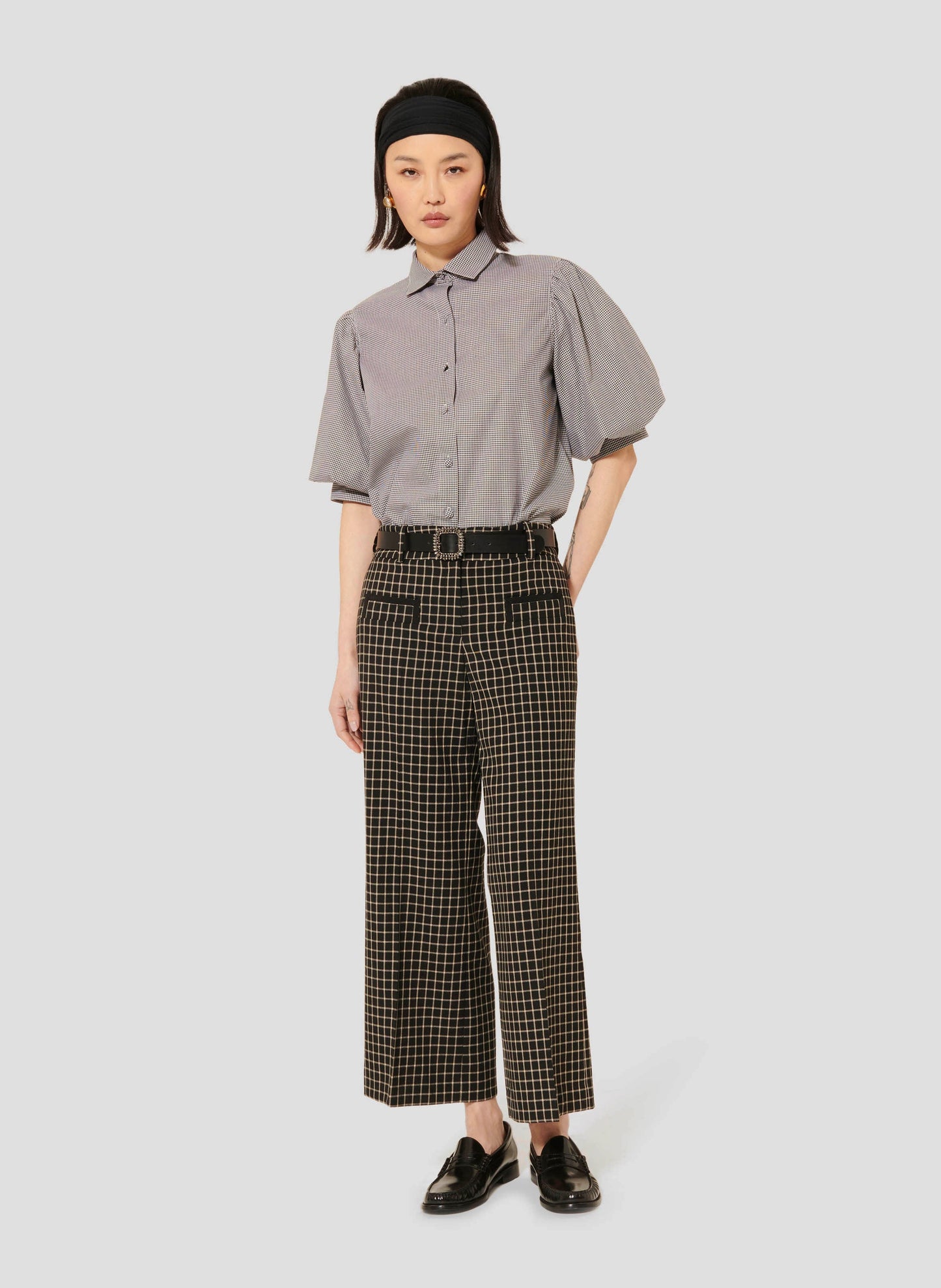 Model wearing Tara Jarmon Plaid Black Pants with Trimmed Pockets.