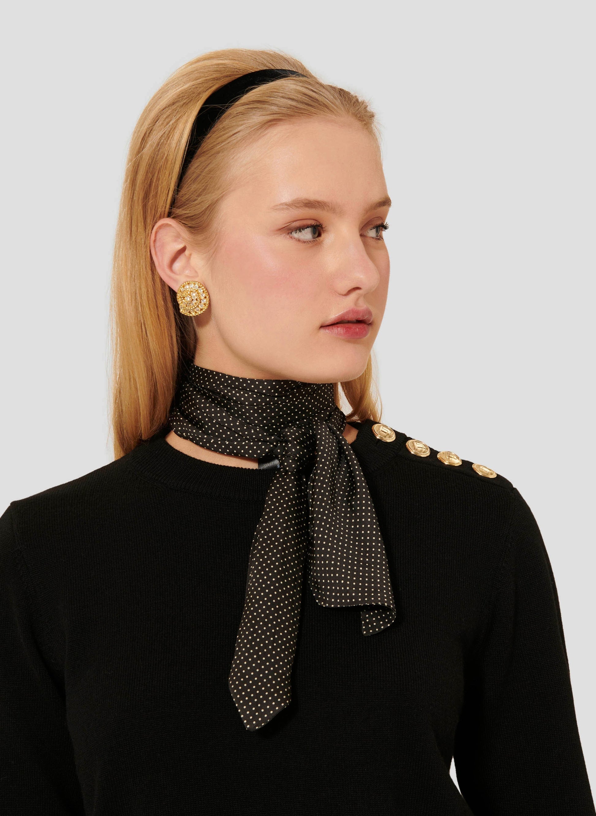 Luxurious Merino Wool Top in Black with Striped Cuffs and Jewel Button Detail.