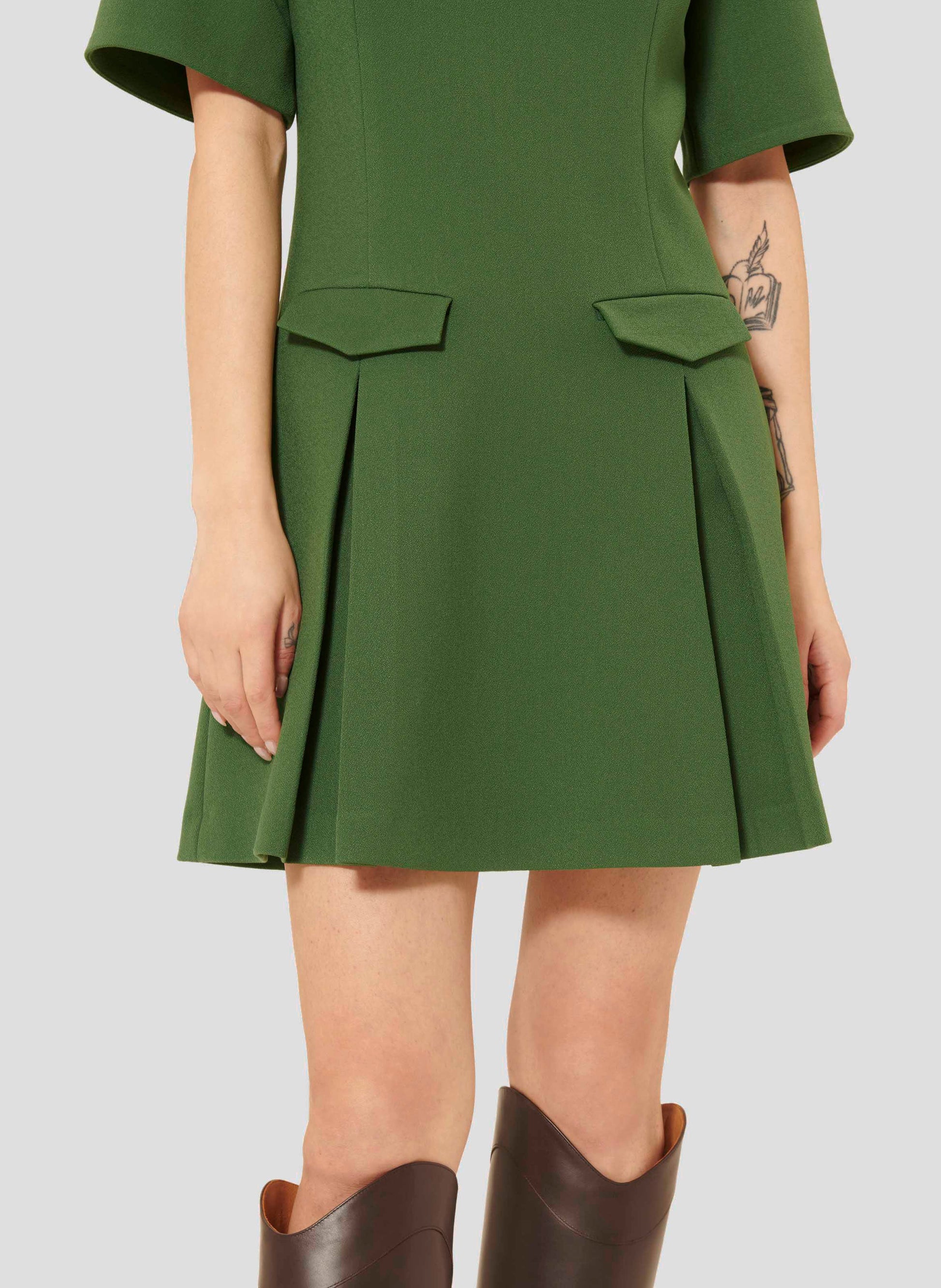 Short Green Dress with Flared Silhouette and Pleated Skirt.