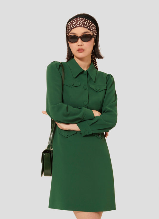 Model wearing Tara Jarmon short green crepe dress with shirt collar.