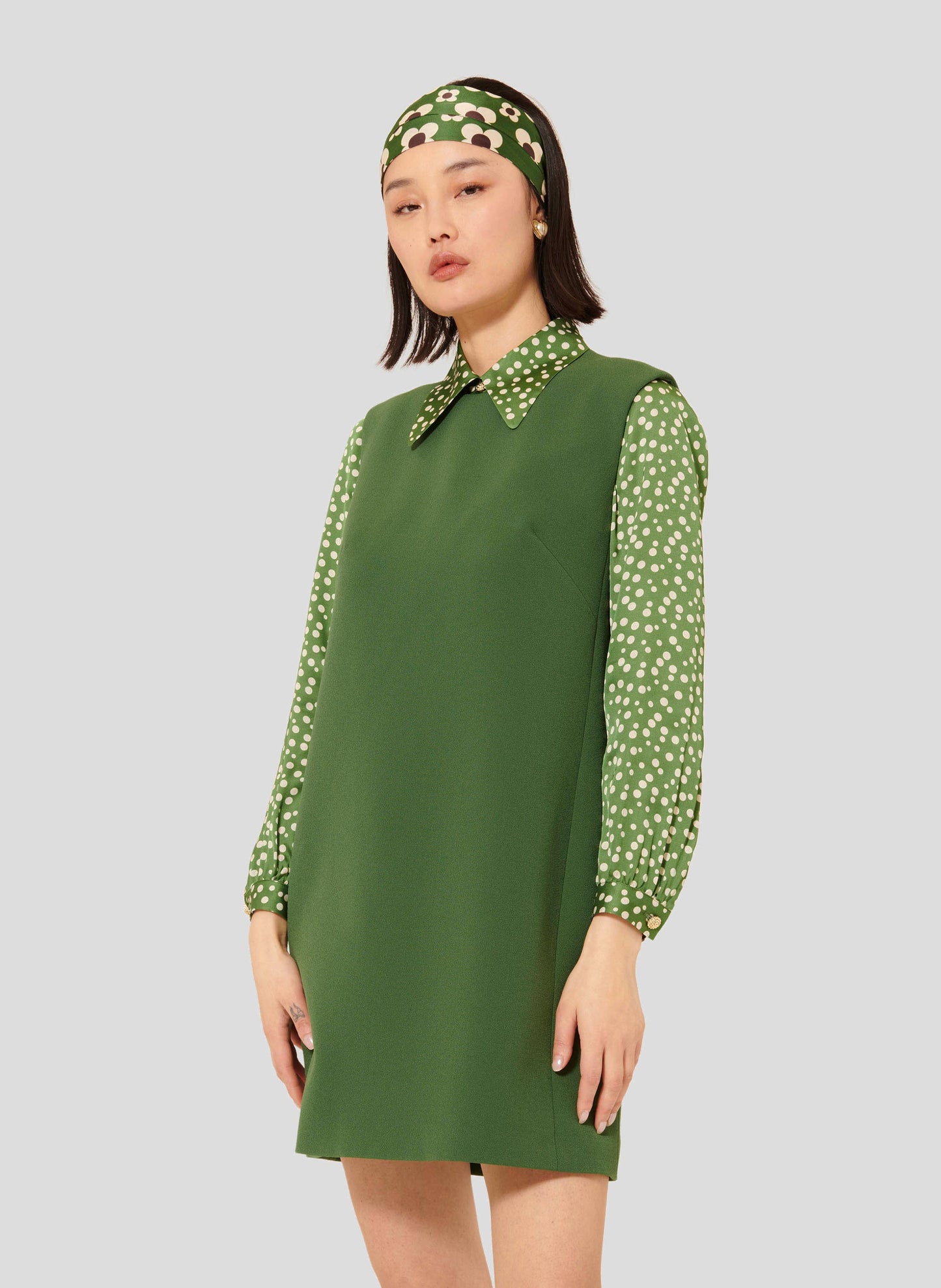 Model wearing Tara Jarmon Cactus Green Sleeveless Crepe Dress with Backless Detail.