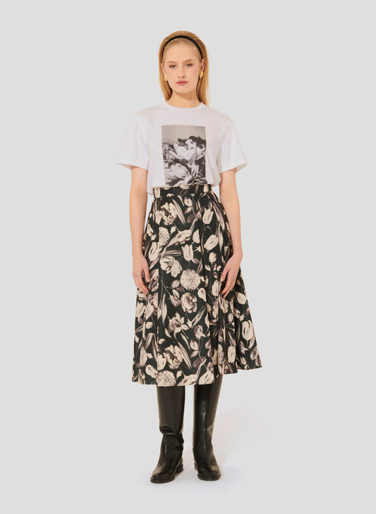 Model wearing Tara Jarmon White Cotton T-Shirt with Floral Print and Rhinestones.