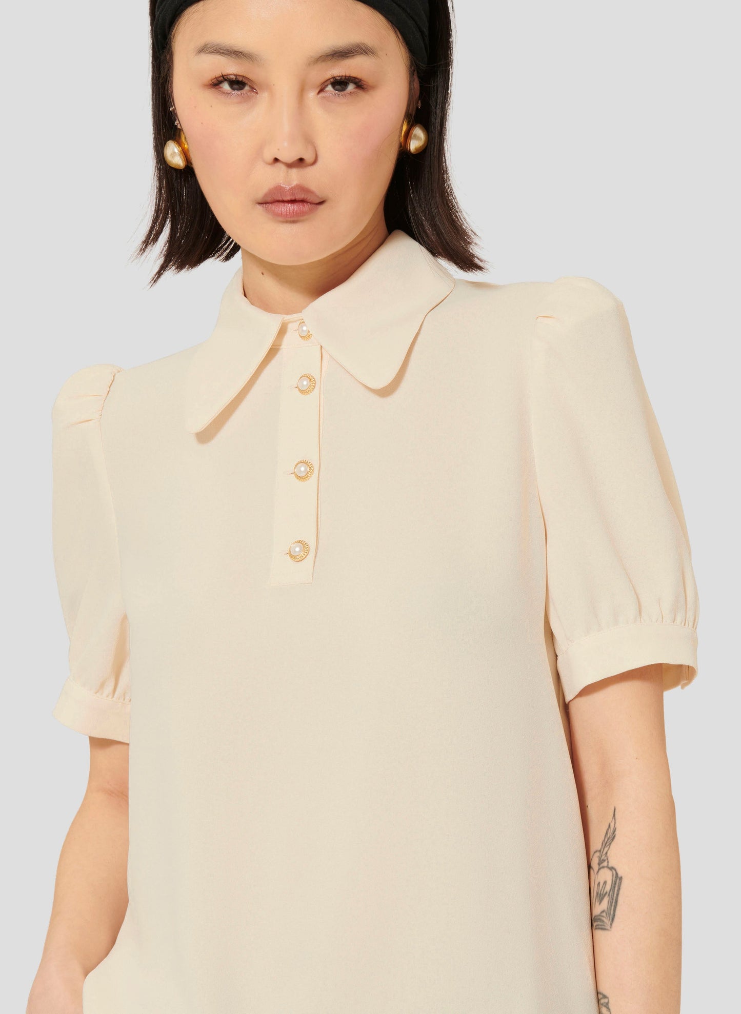 Ecru Short Sleeves Top with Jeweled Buttons. 