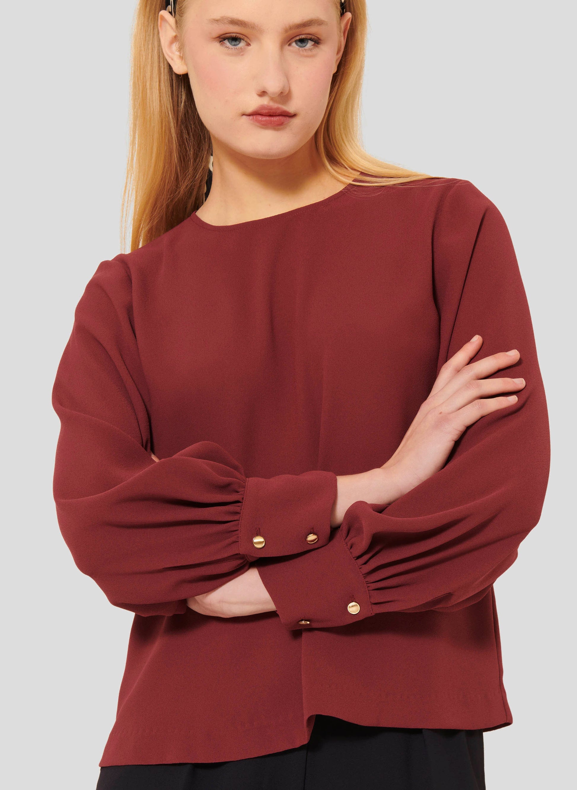 Round Neck Top in Burgundy with Gold Button Closure.