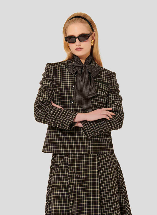 Model wearing Tara Jarmon Black Plaid Suit Jacket with Lapel Collar and Buttoned Cuffs.