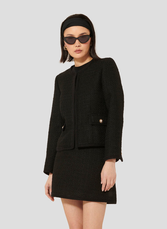 Iridescent Black Tweed Jacket with Jewel-Embellished Flap Pockets.