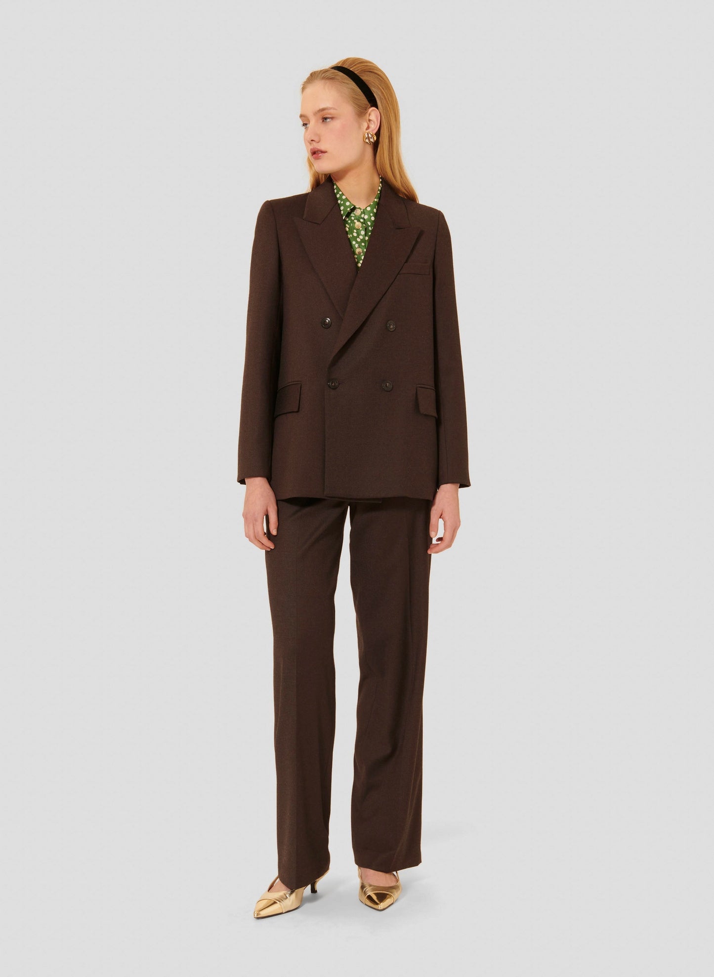 Women's chocolate brown long sleeve jacket with two side pockets. 