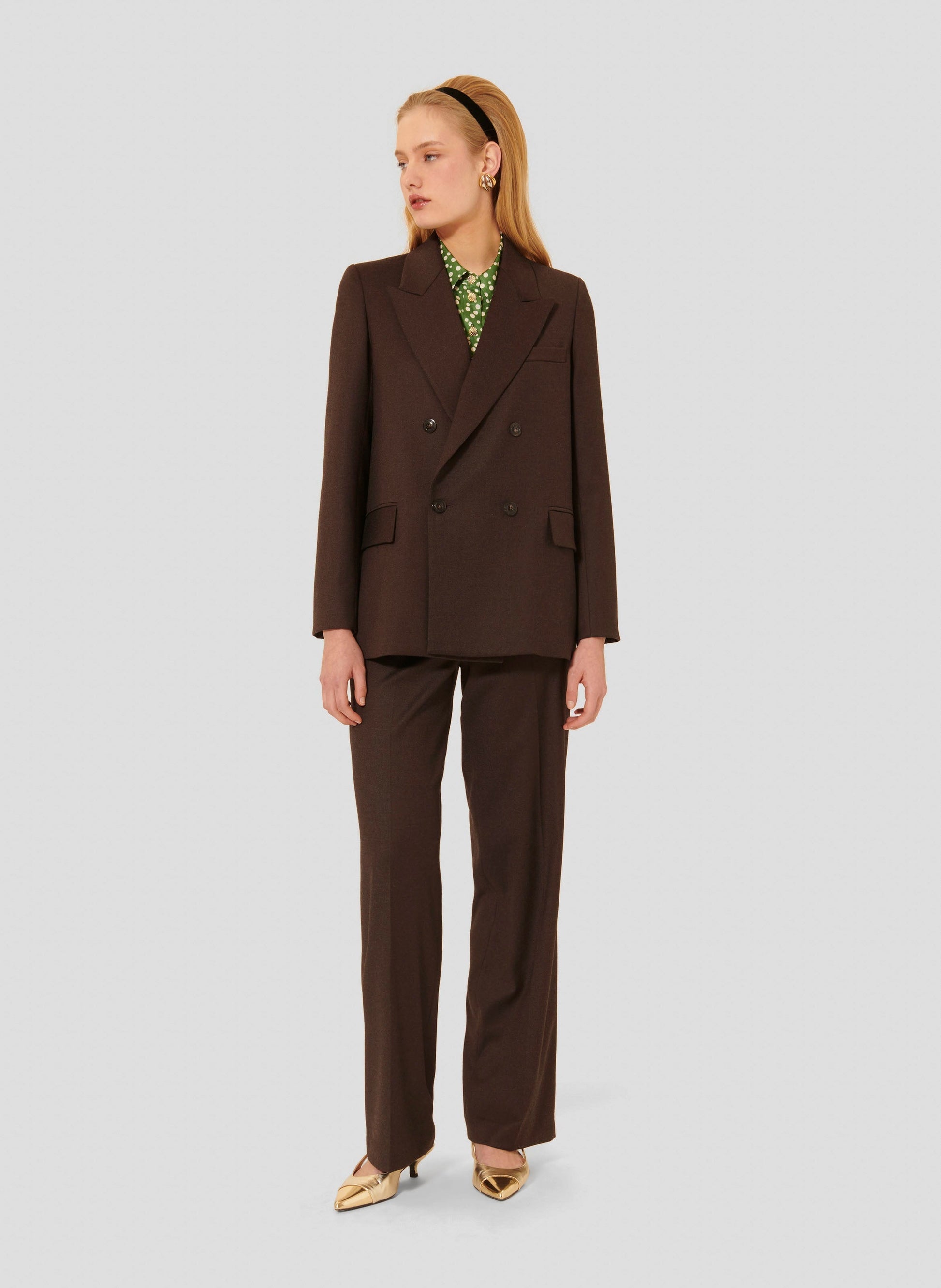 Women's chocolate brown long sleeve jacket with two side pockets. 