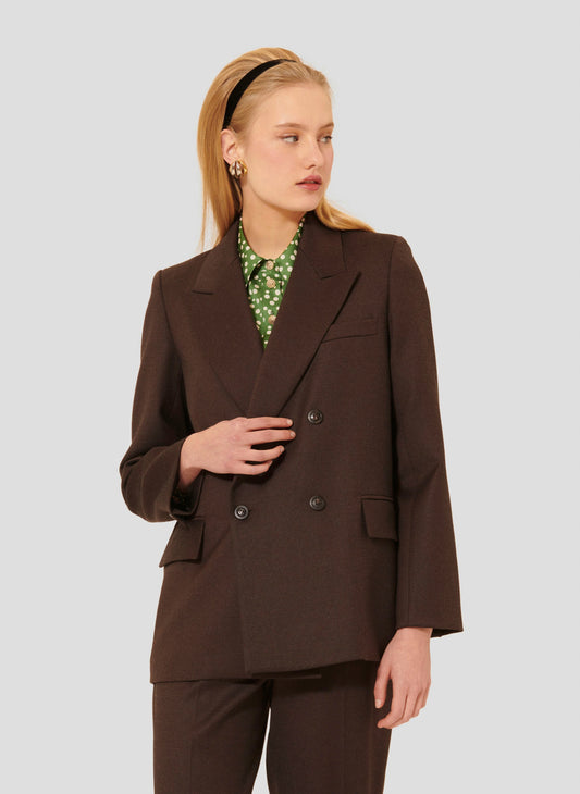 Model wearing Tara Jarmon brown suit Jacket with buttoned cuffs. 