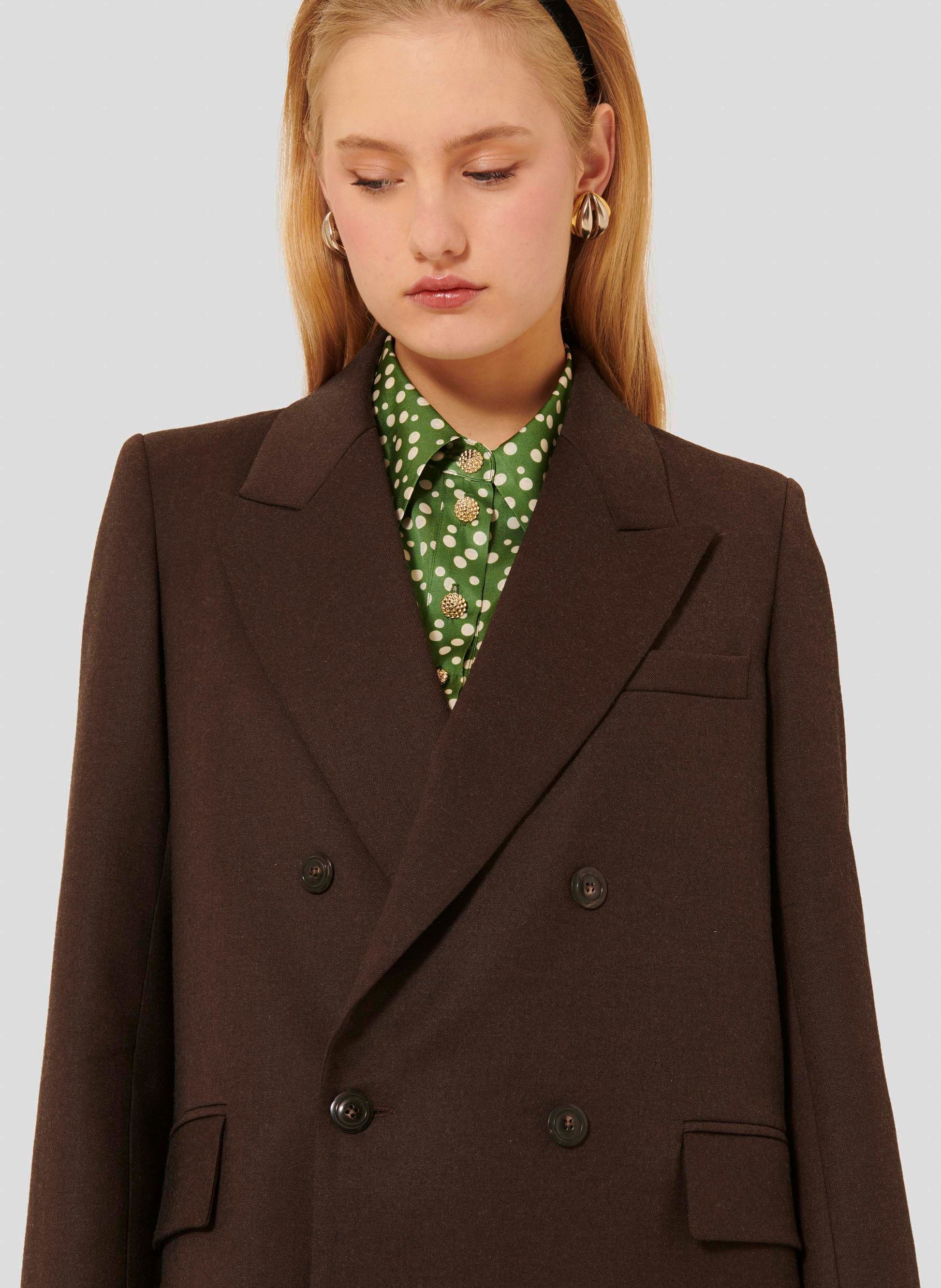Women's chocolate brown jacket with slightly fitted waist and small shoulder pads. 