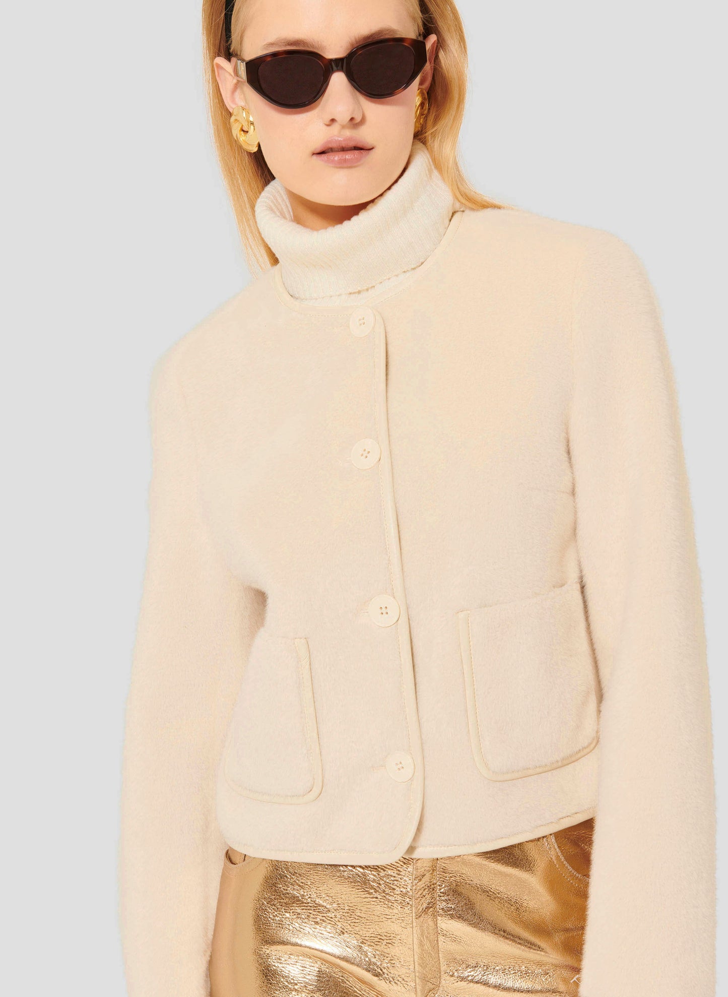 Cream Faux Fur Jacket with Round Neckline and Button Closure.